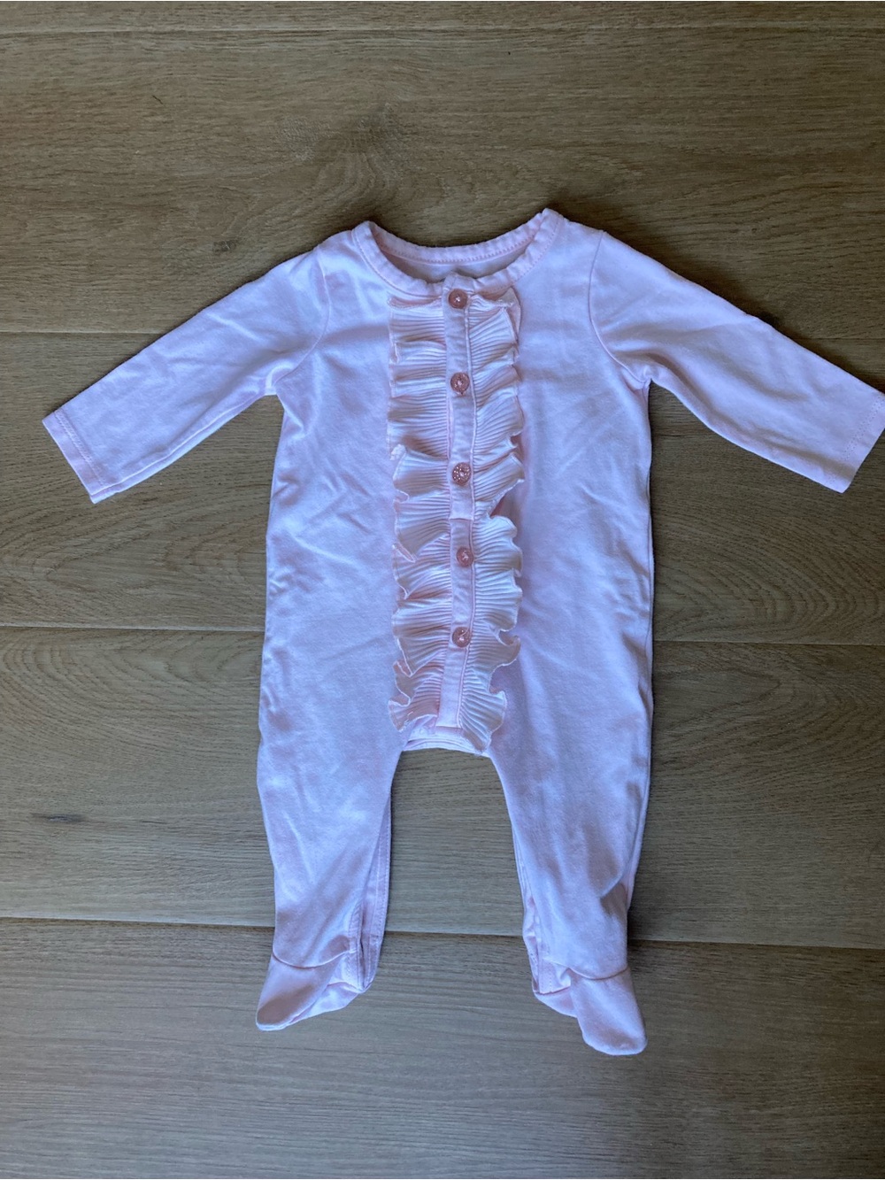 Mud Pie Light Pink Ruffle Front Footed Onesie